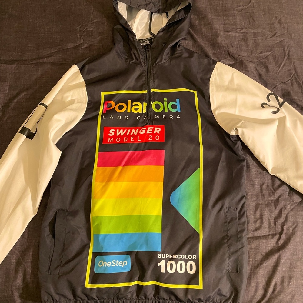 A Polaroid wind-breaker jacket, size medium. It’s black and white.